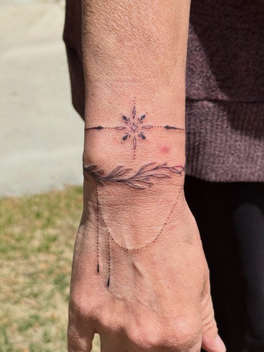 Delicate floral wrist tattoo with intricate details Tattoo Design
