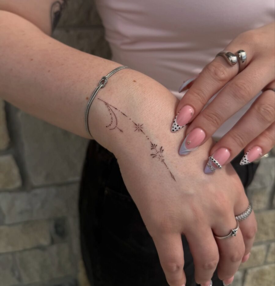 Elegant celestial designs on delicate skin Tattoo Design