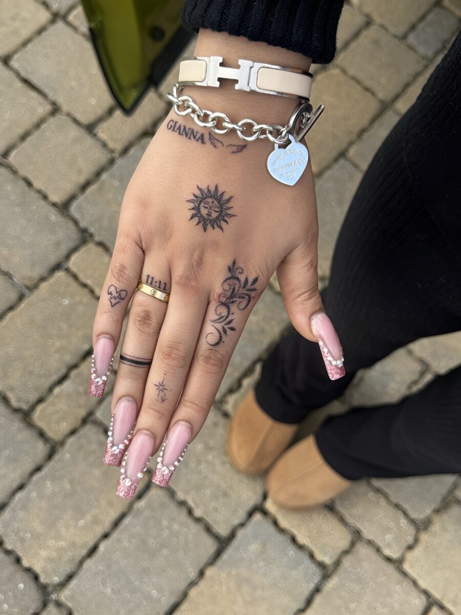 Elegant Dainty Tattoos on a Handsome Hand Tattoo Design