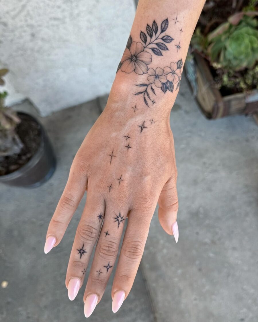 Elegant floral and star hand tattoos Tattoo Design