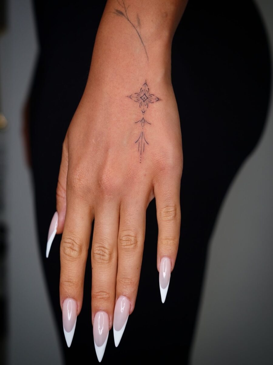 Elegant Hand Tattoo with Intricate Details Tattoo Design