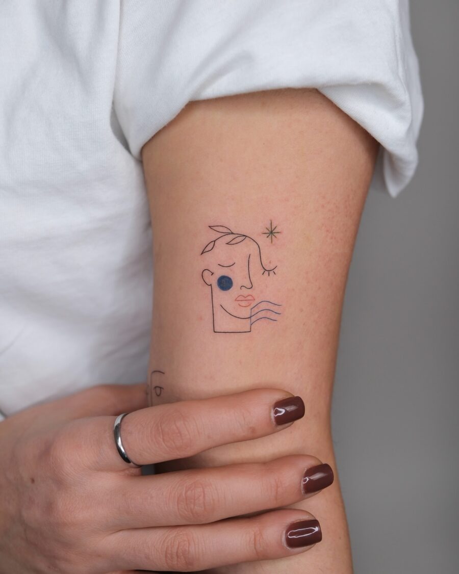 Minimalist face tattoo with artistic flair Tattoo Design