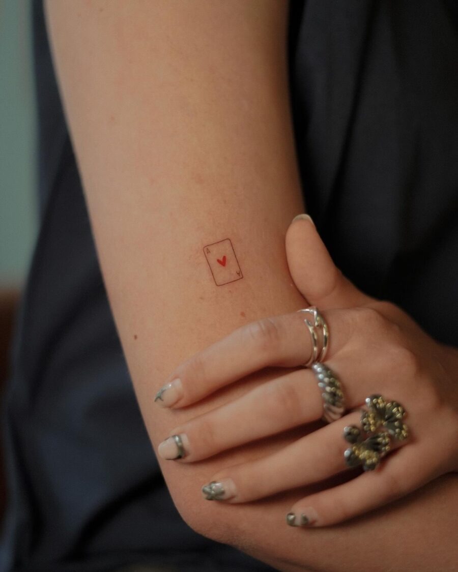Minimalist heart card tattoo on the arm Tattoo Design