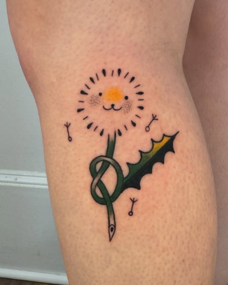 Charming dandelion tattoo with a cute face Tattoo Design