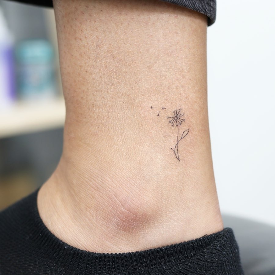 Charming minimalist dandelion tattoo on ankle Tattoo Design