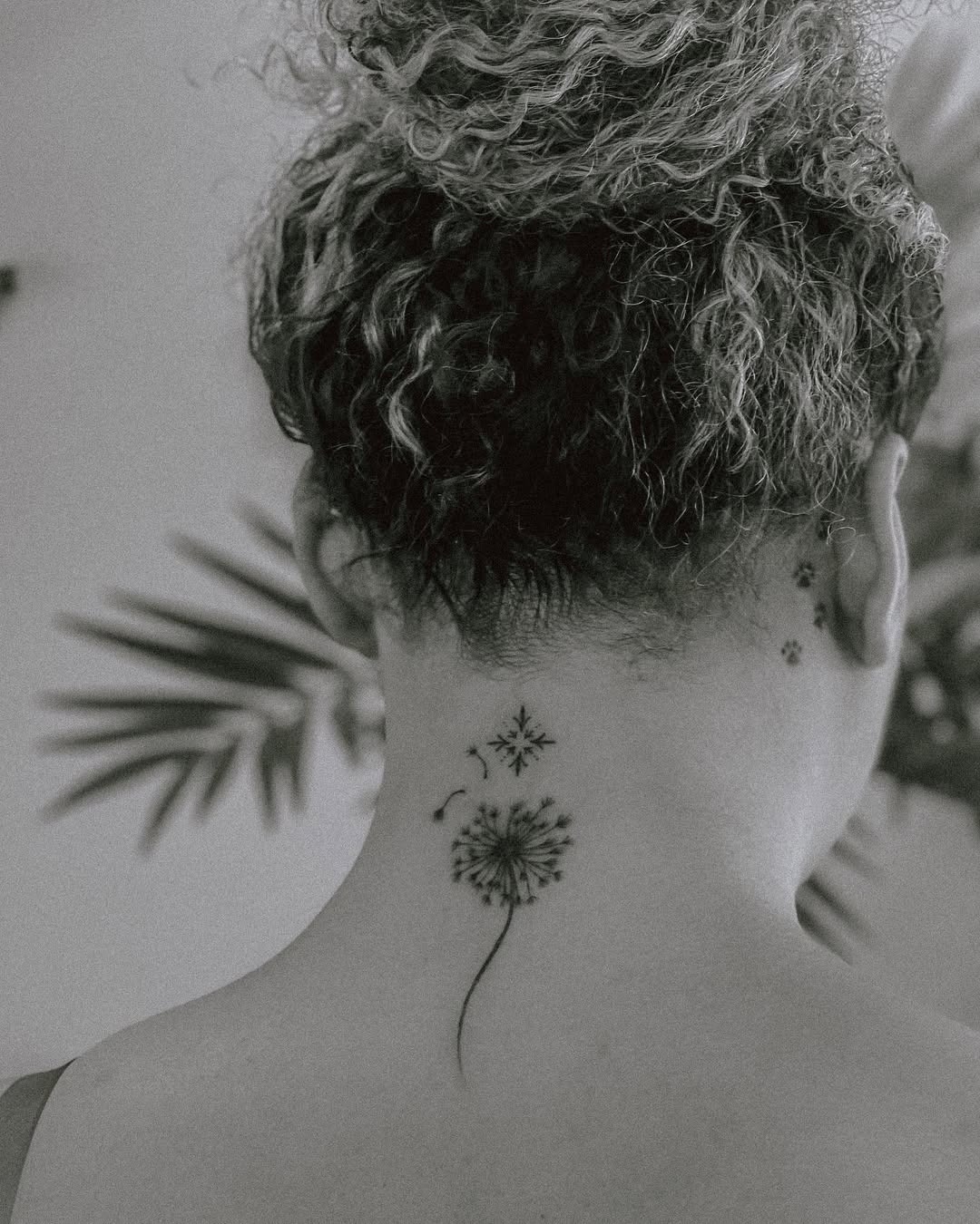 Delicate dandelion tattoo on the nape. Tattoo Design