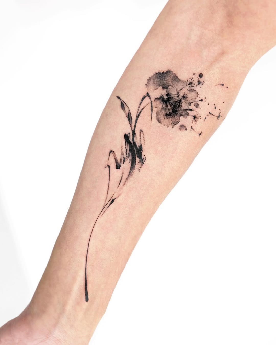 Elegant black watercolor dandelion tattoo design Tattoo Design