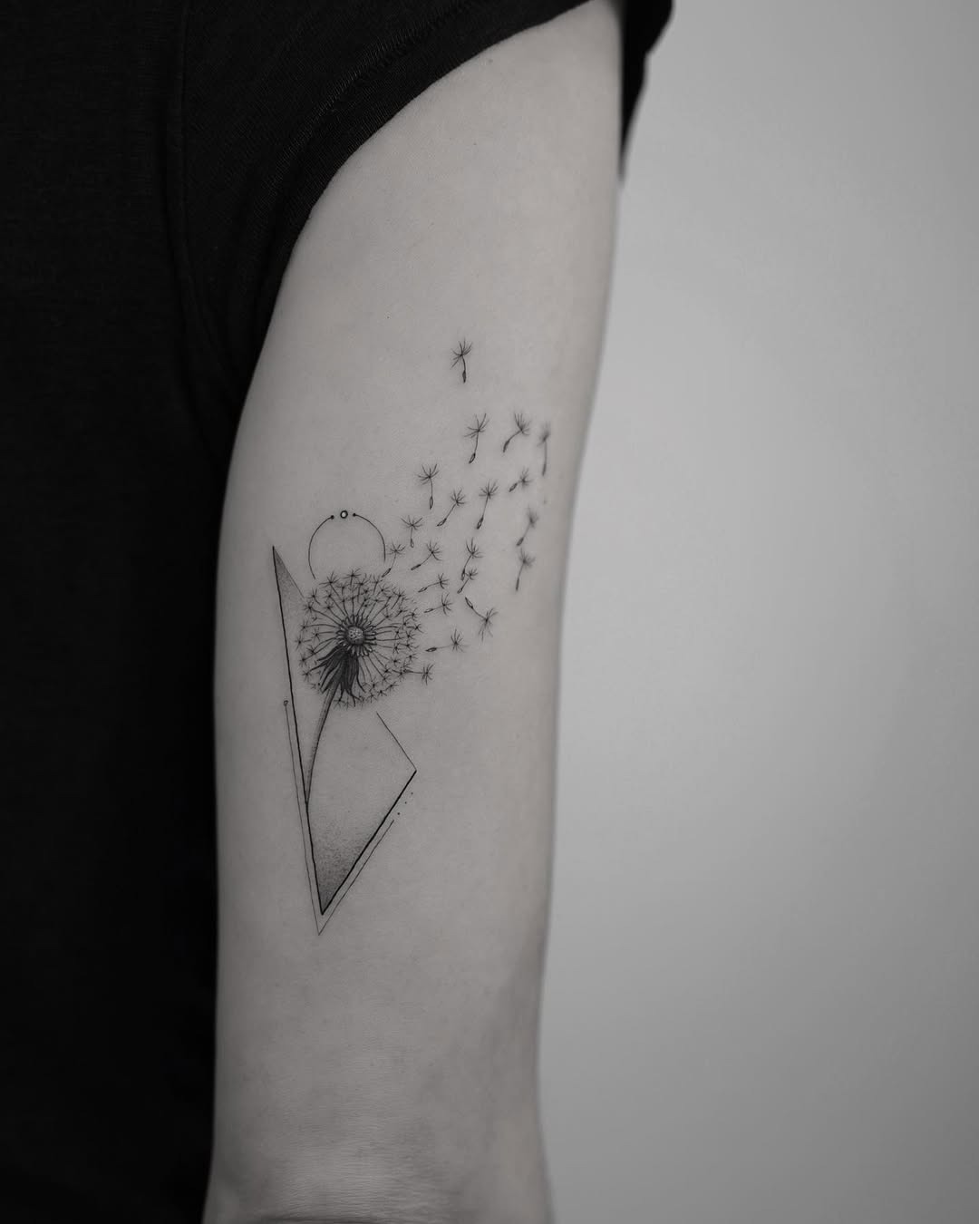 Elegant dandelion with geometric design elements Tattoo Design