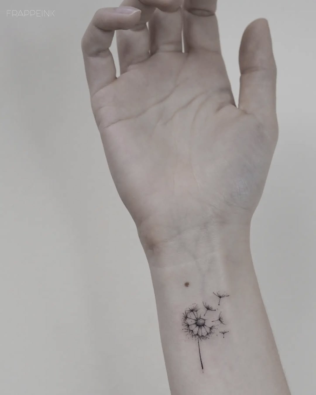 Elegant minimalist dandelion wrist tattoo design Tattoo Design