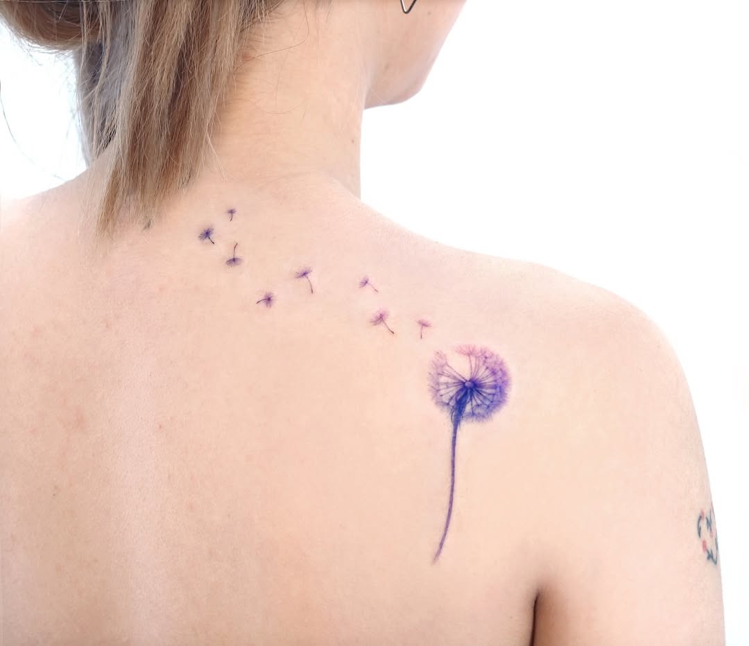 Elegant purple dandelion with graceful seed trail Tattoo Design