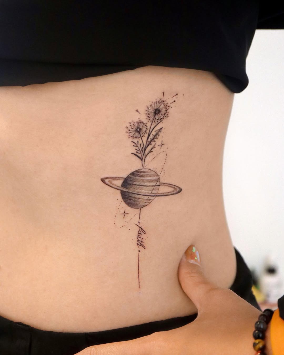 Whimsical dandelion merging with a planet design Tattoo Design