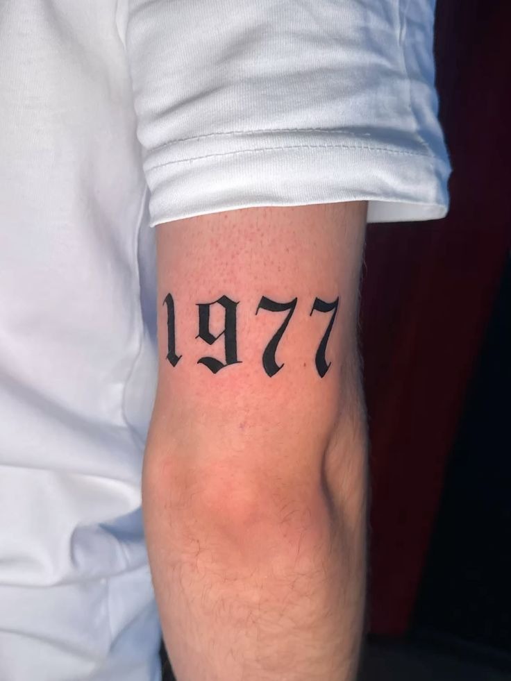 Bold 1977 Year Tattoo on Arm Tattoo Design