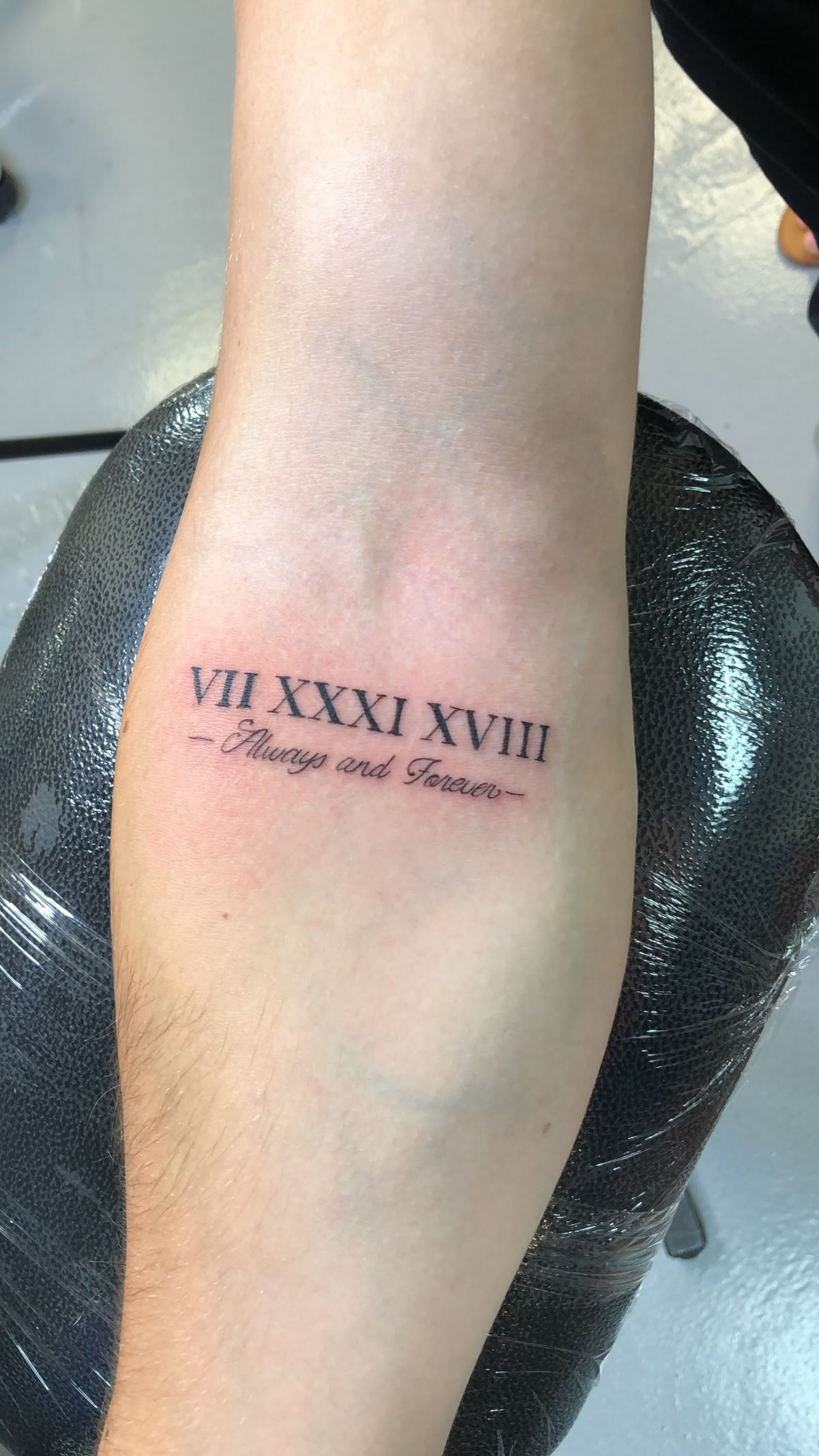 Roman Numeral Date Tattoo with Cursive Vow Tattoo Design