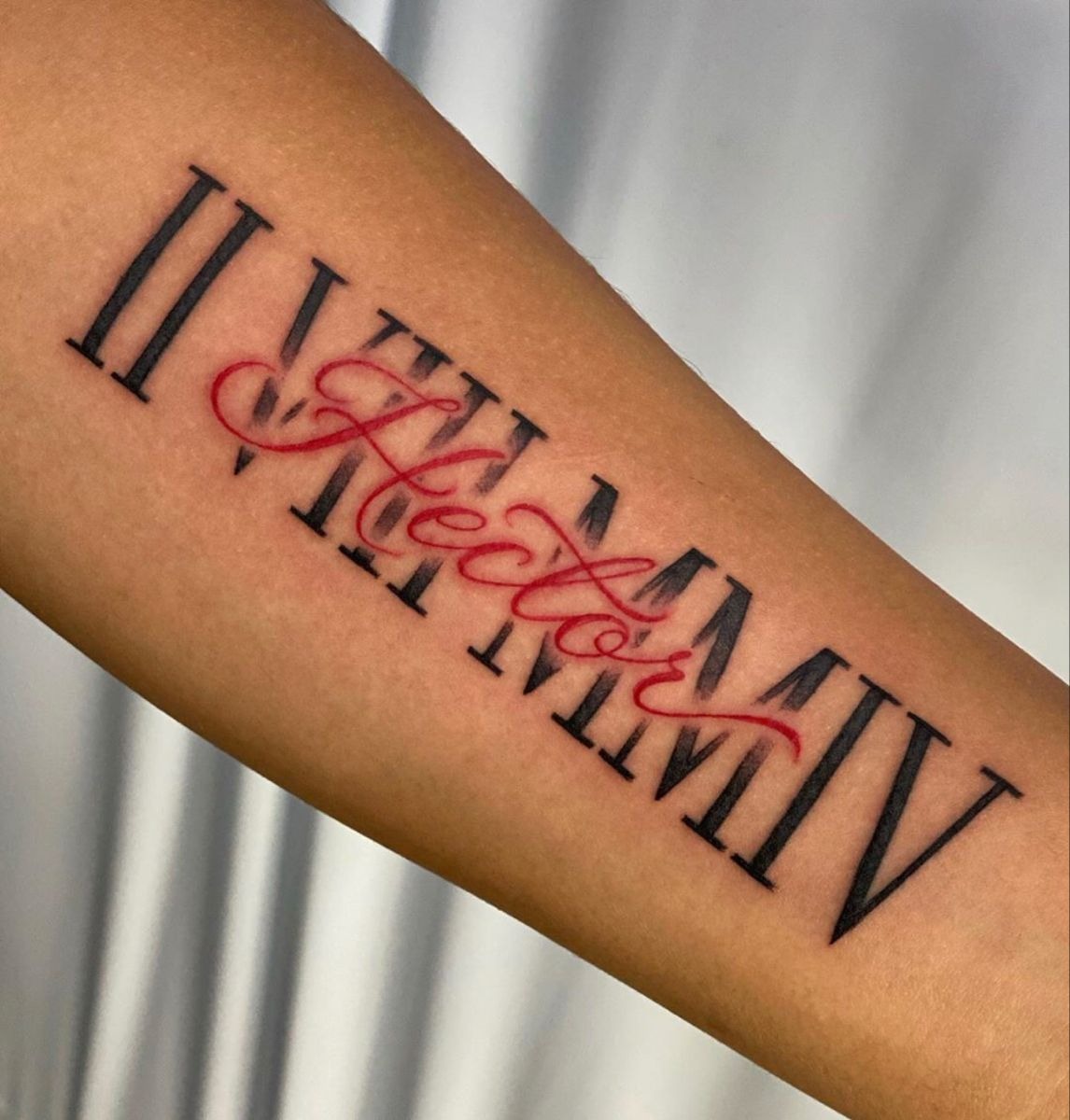 Roman Numeral Name Tattoo in Red Script Tattoo Design