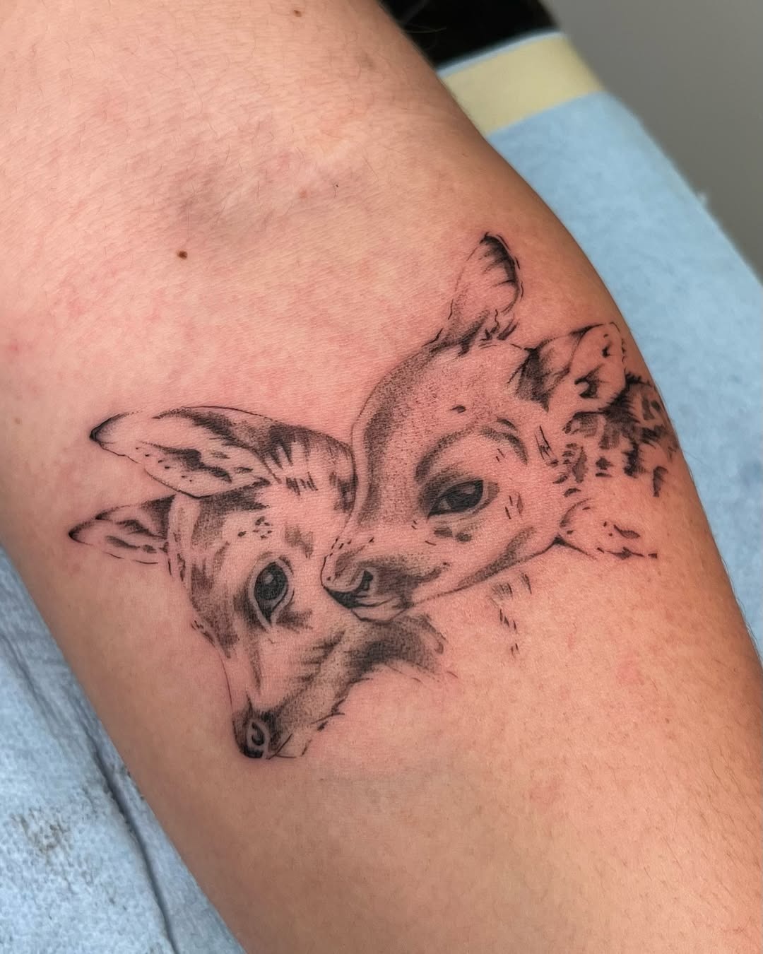 Adorable twin fawns tattoo capturing innocence Tattoo Design
