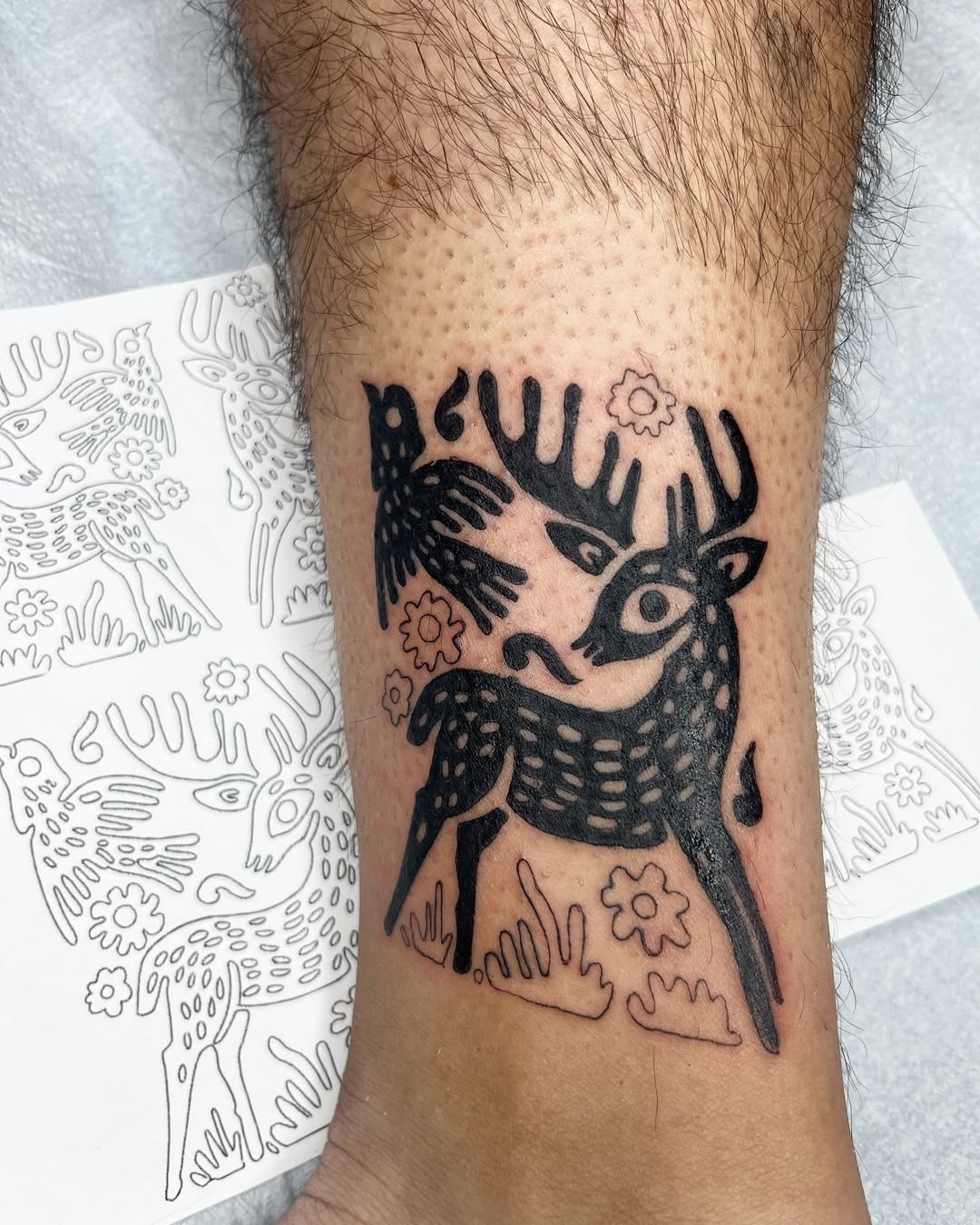 Artistic deer tattoo with floral accents Tattoo Design
