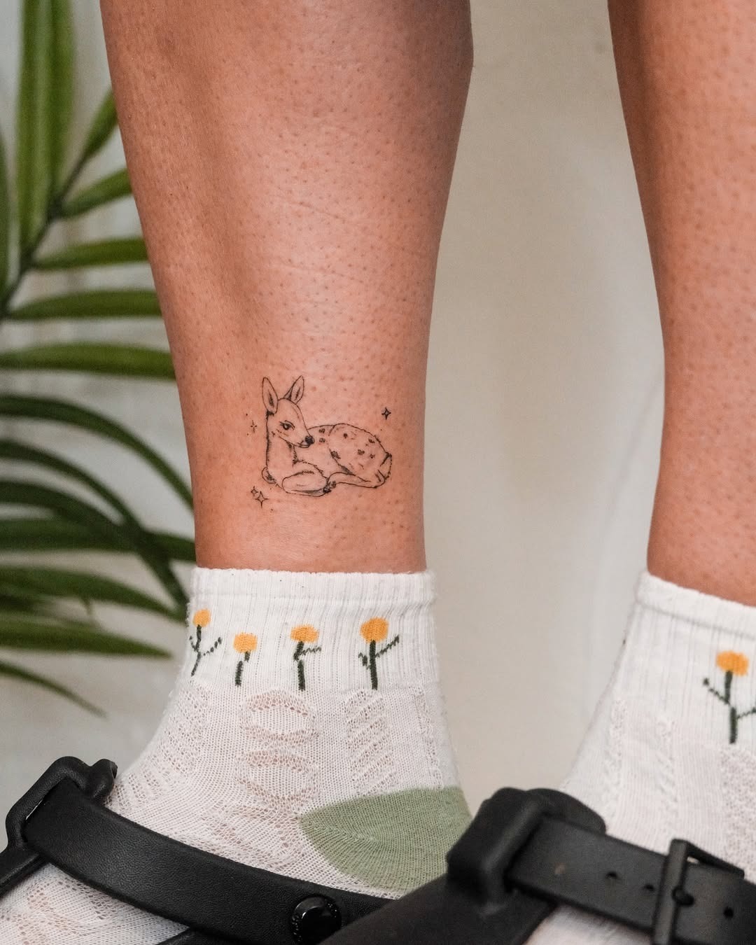 Charming small deer tattoo on ankle Tattoo Design