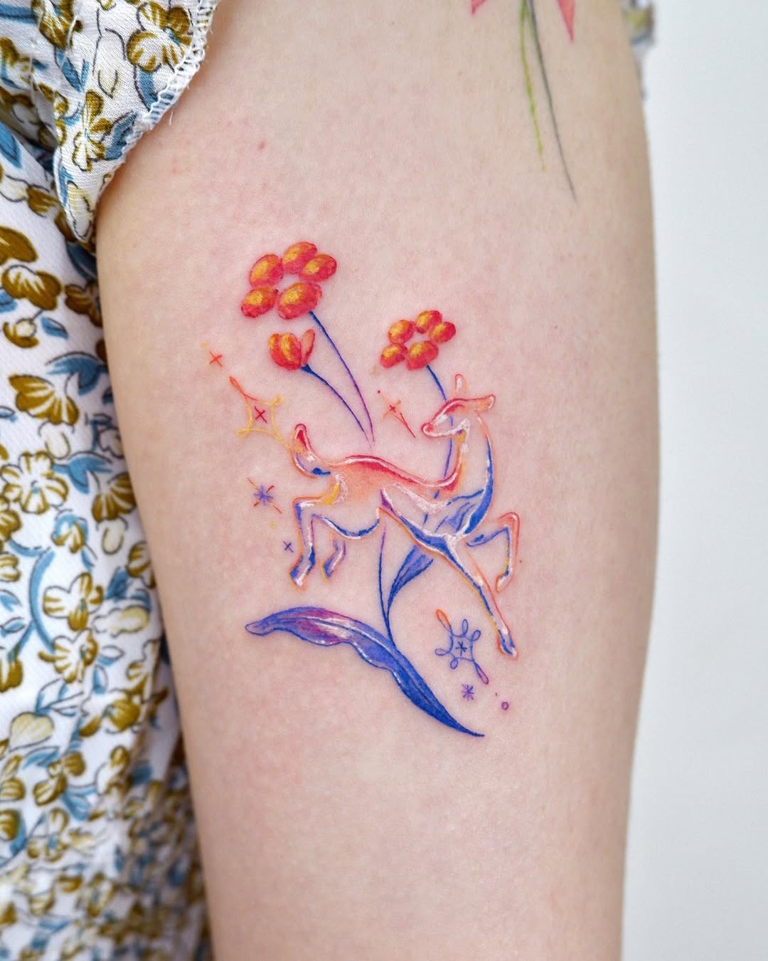 Colorful watercolor deer with floral accents Tattoo Design
