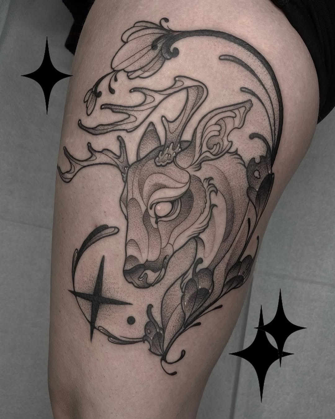 Elegant deer tattoo with floral elements Tattoo Design