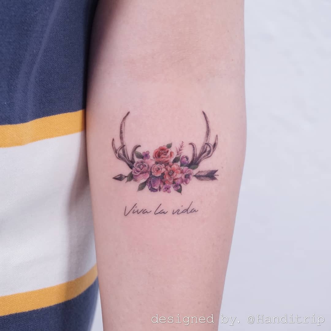 Elegant floral deer tattoo with a vibrant message Tattoo Design