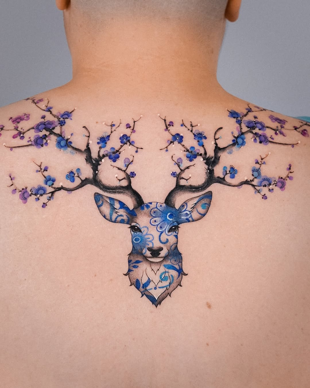 Floral deer tattoo with vibrant colors and details Tattoo Design
