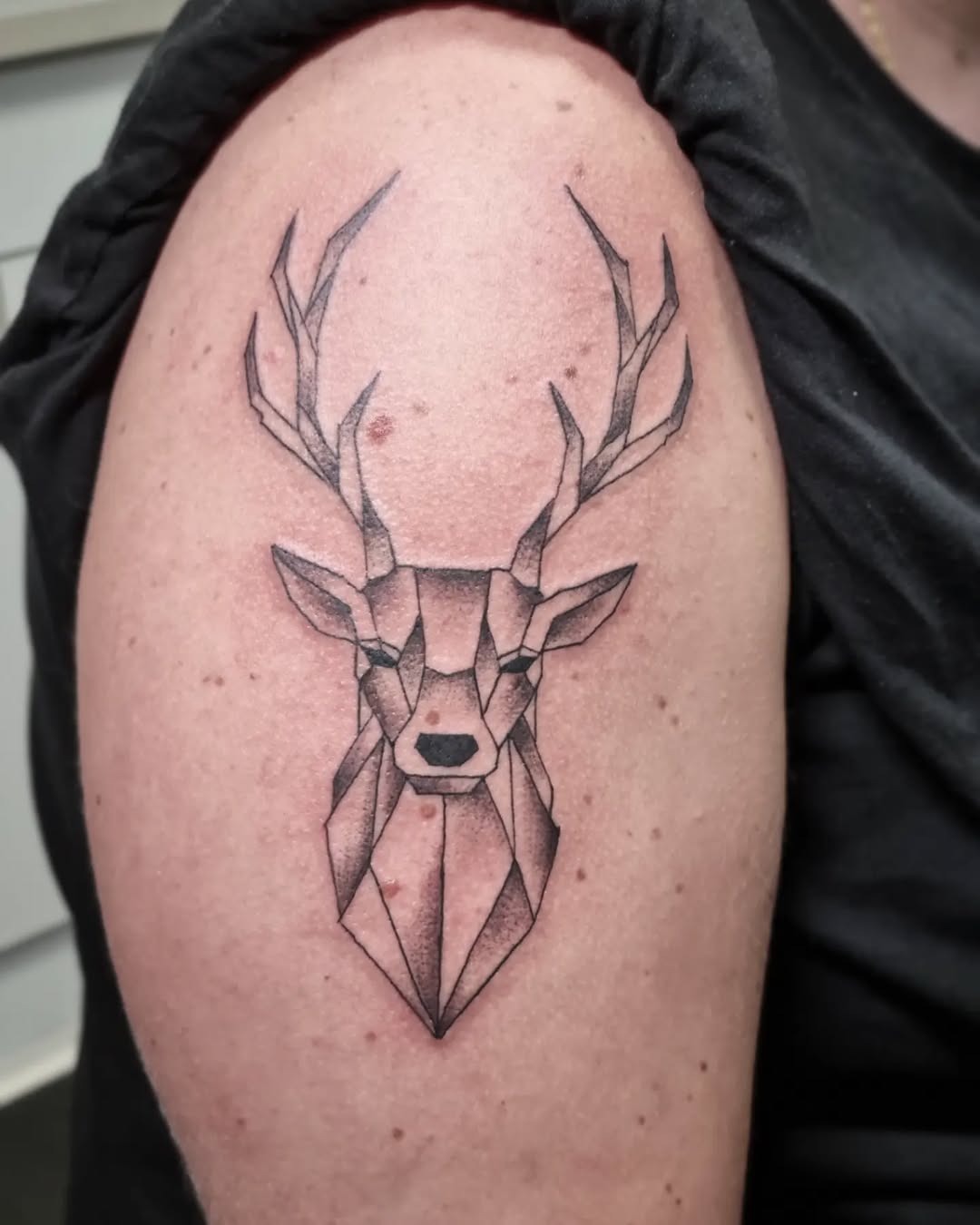 Geometric deer head with elegant antlers design Tattoo Design