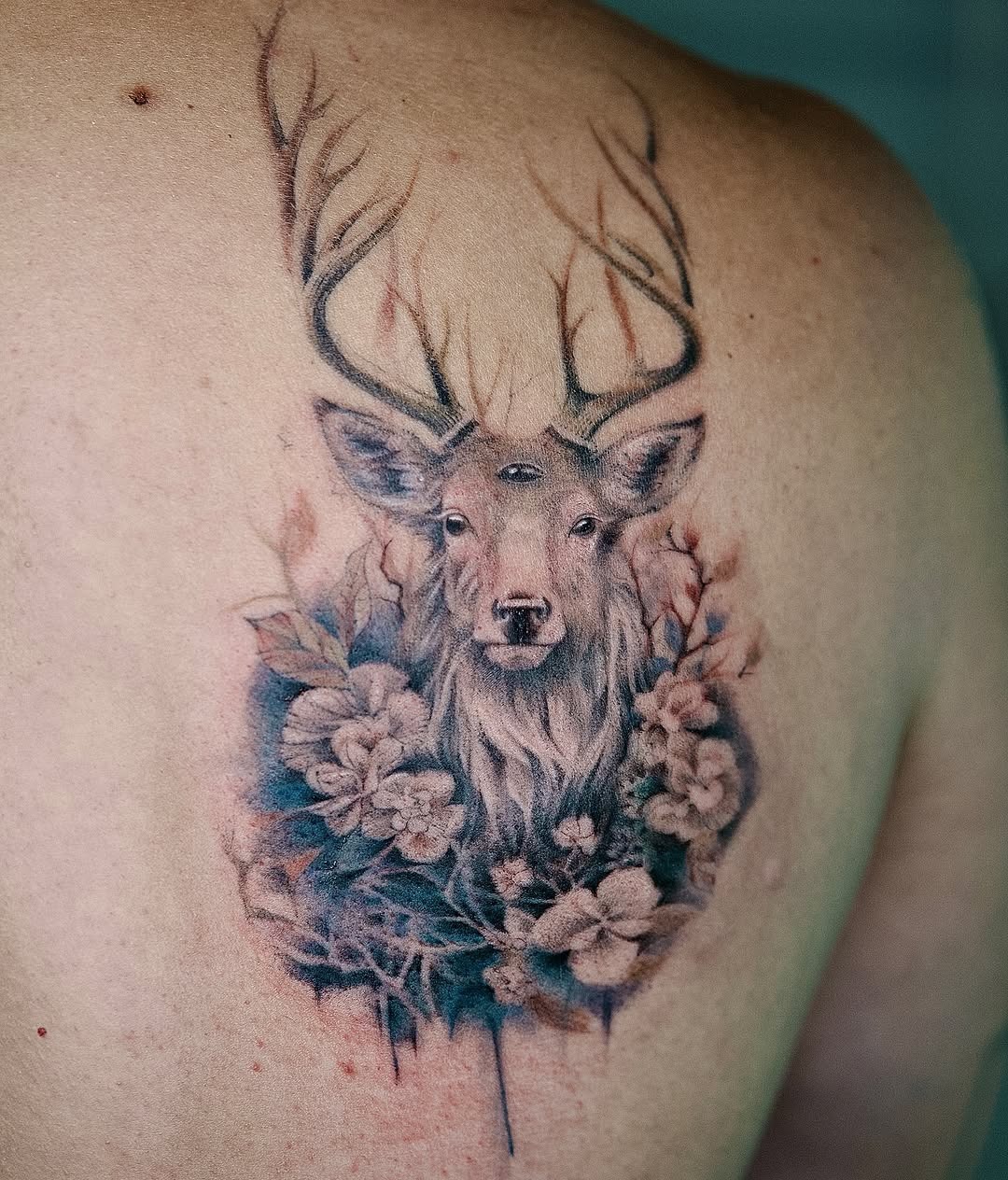 Majestic deer with floral accents ink design Tattoo Design