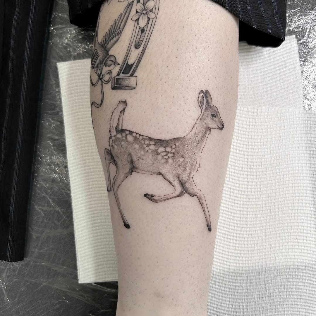 running deer tattoo on leg Tattoo Design