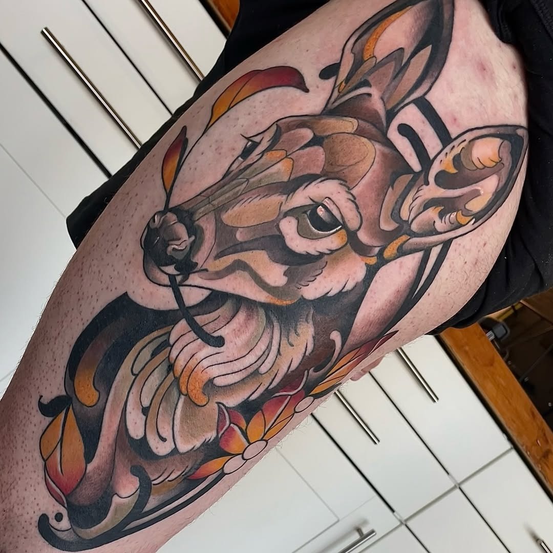 Vibrant deer tattoo adorned with floral patterns Tattoo Design