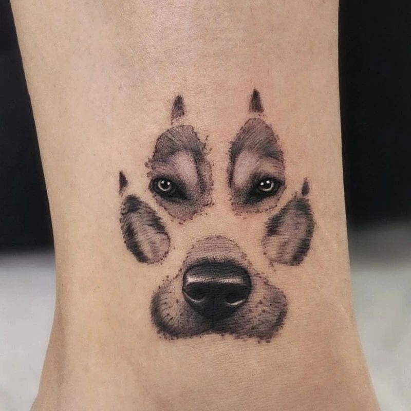 Paw Print Face Illusion Tattoo Tattoo Design