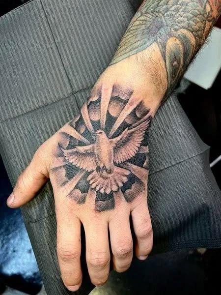 Dove Hand Tattoo With Radiant Background Tattoo Design