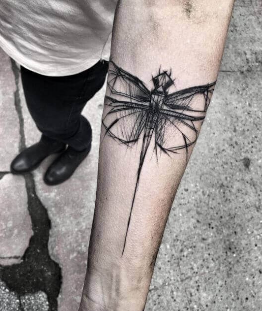Artistic Expression: Abstract Dragonfly on the Forearm Tattoo Design