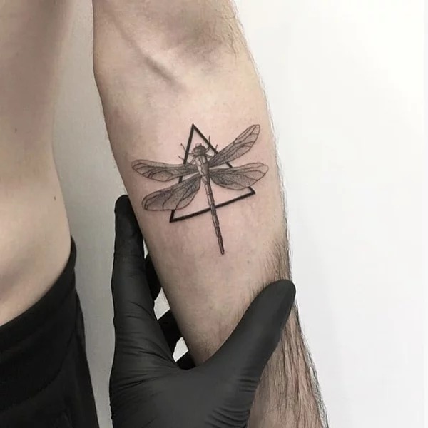 Geometric Precision: The Stenciled Dragonfly Tattoo Design