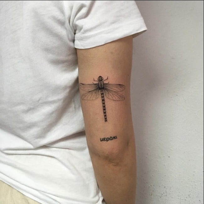 Personal and Meaningful: The Upper Arm Dragonfly with Text Tattoo Design