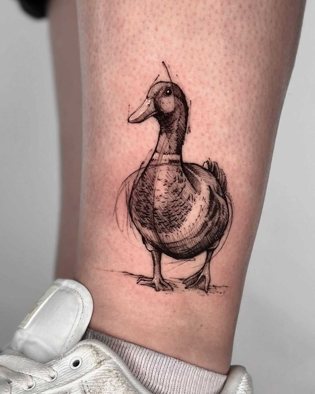 Artistic duck tattoo in playful style Tattoo Design