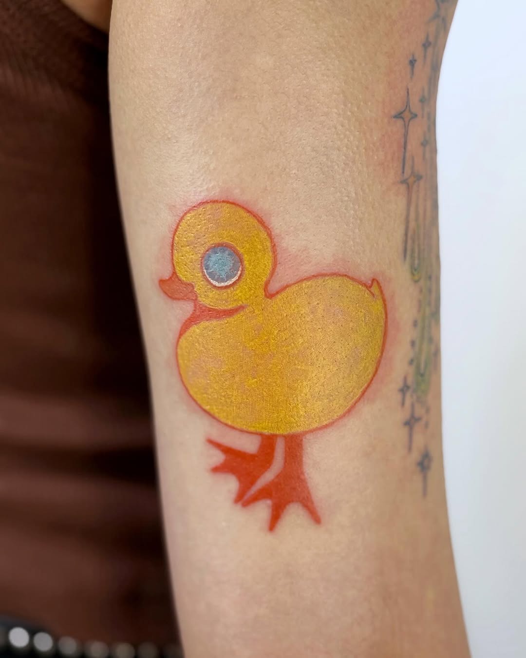 Bright and playful yellow duck tattoo design Tattoo Design