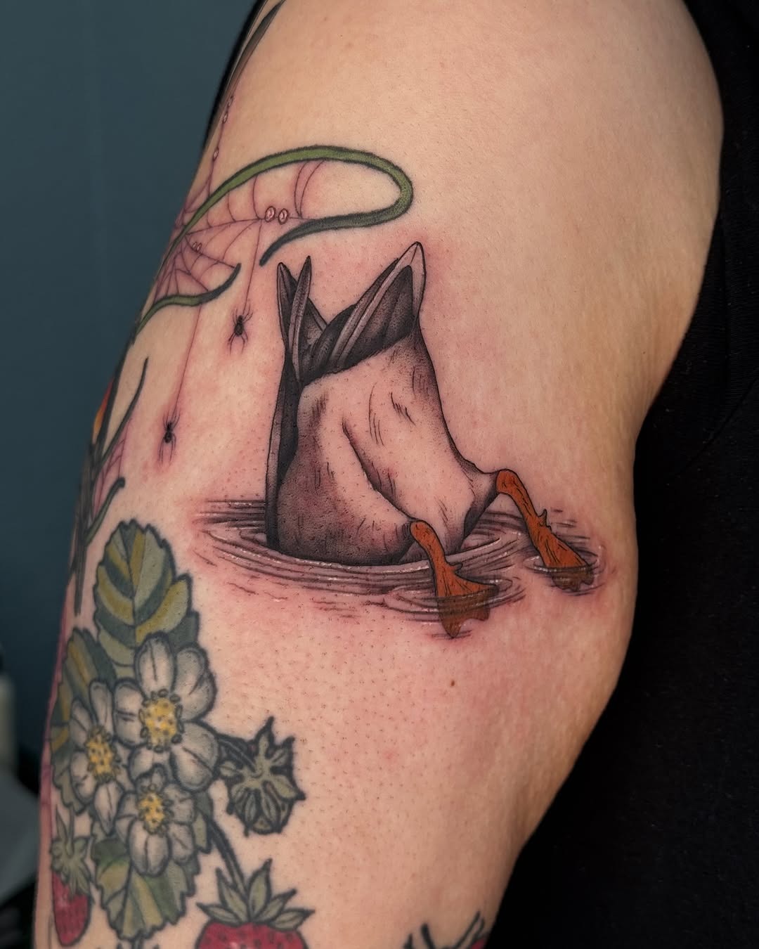 Charming duck tattoo nestled in water Tattoo Design