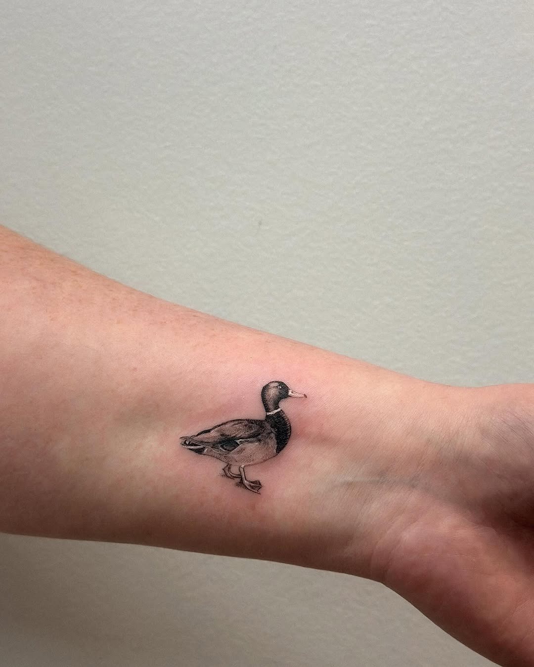 Charming duck tattoo on the forearm Tattoo Design