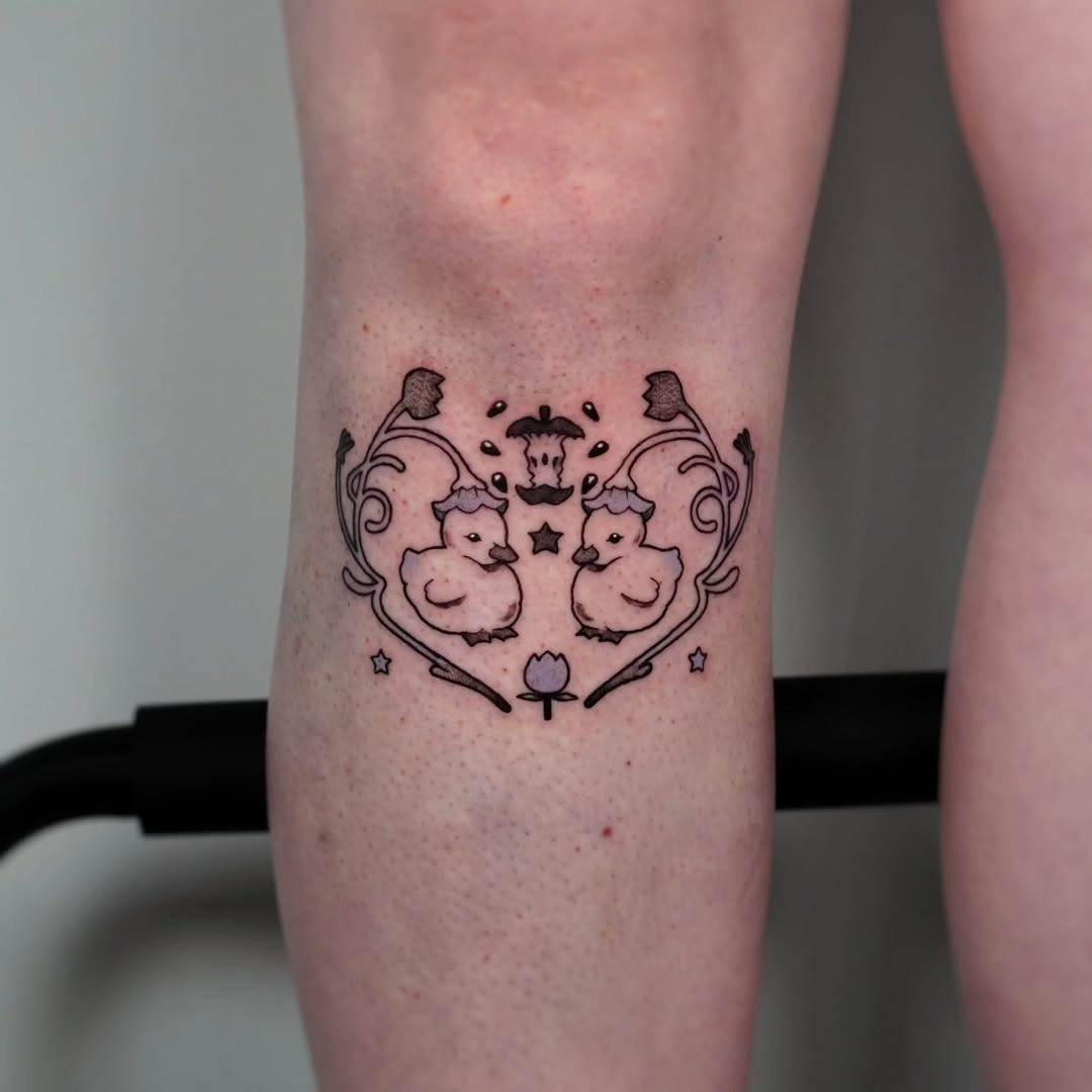 Charming duck tattoo with floral accents Tattoo Design