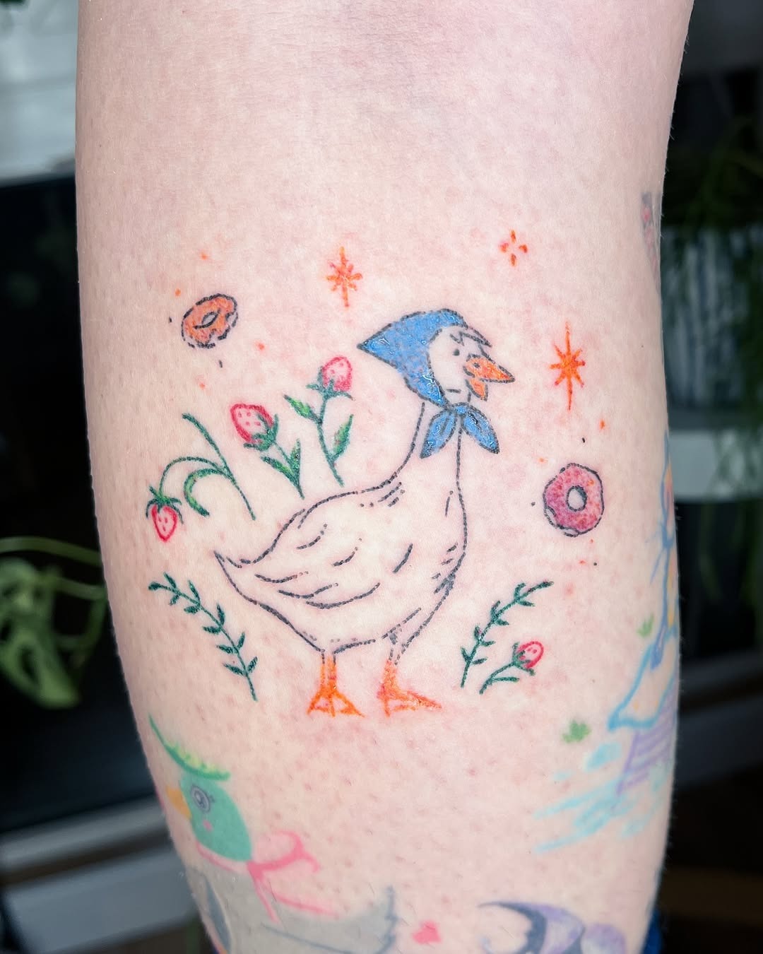 Charming duck tattoo with floral accents Tattoo Design