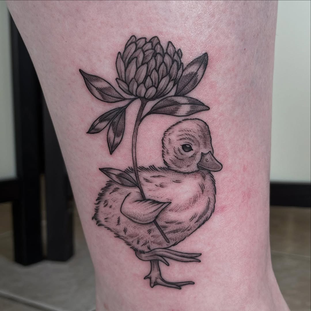 Charming duck tattoo with floral details Tattoo Design