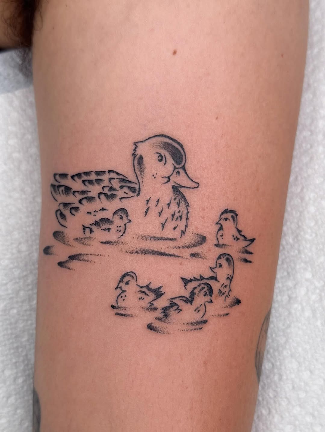 Charming mother duck with her adorable ducklings Tattoo Design
