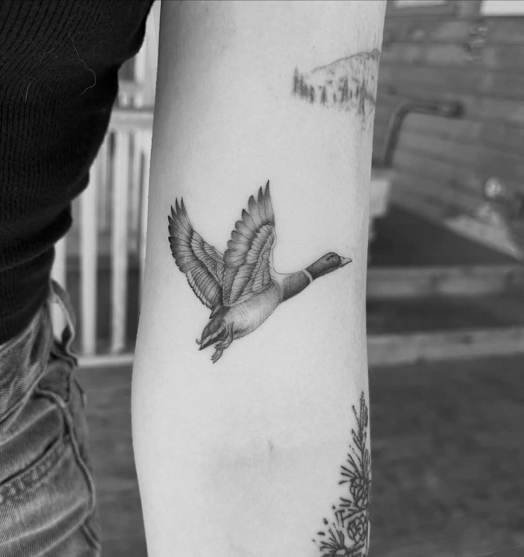 Elegant black and white flying duck tattoo Tattoo Design