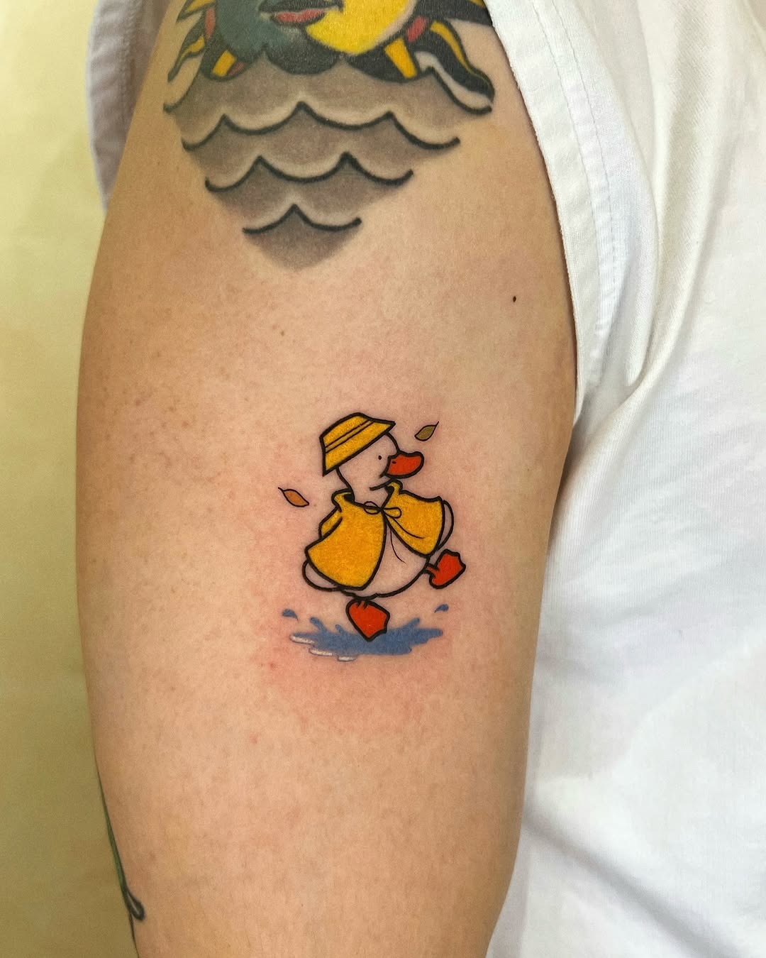 Playful duck tattoo in vibrant colors Tattoo Design
