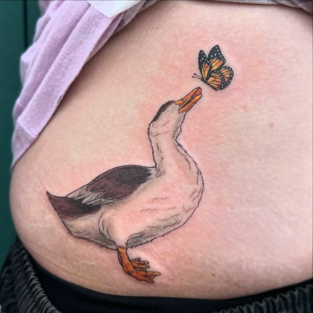 Whimsical duck meeting a delicate butterfly Tattoo Design
