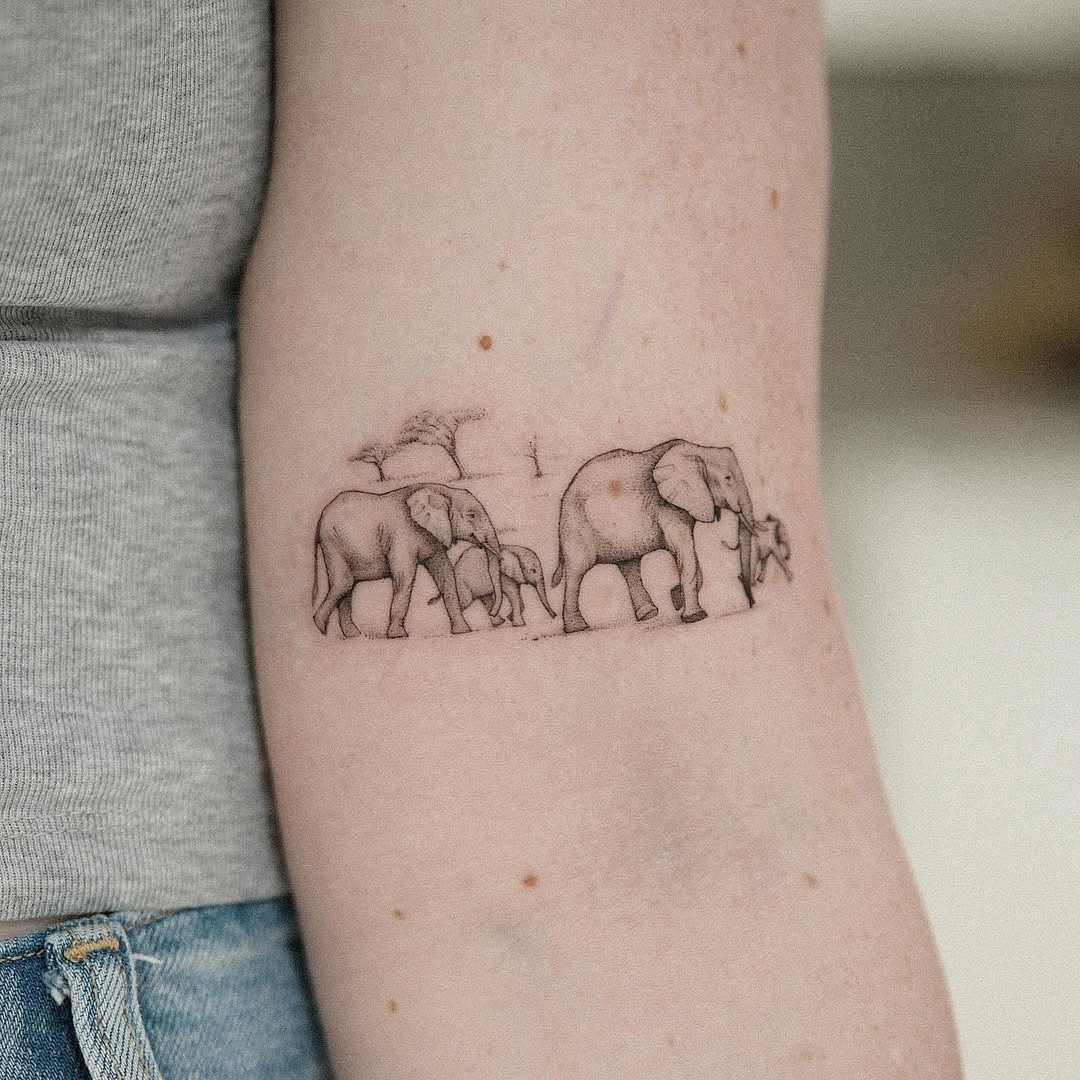 Elegant Line Art of an Elephant Family Tattoo Design