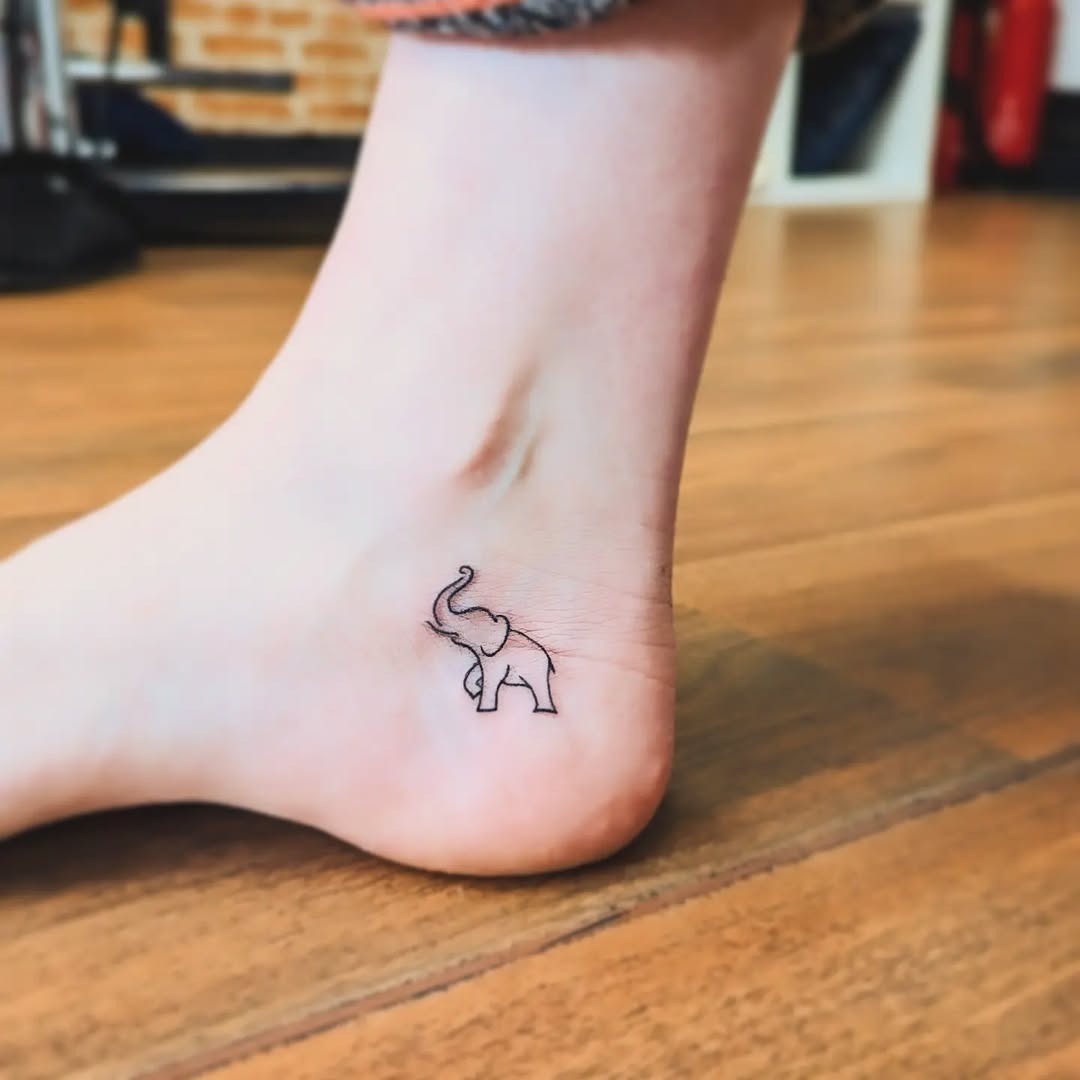 Elegant Minimalist Elephant Tattoo on Ankle Tattoo Design