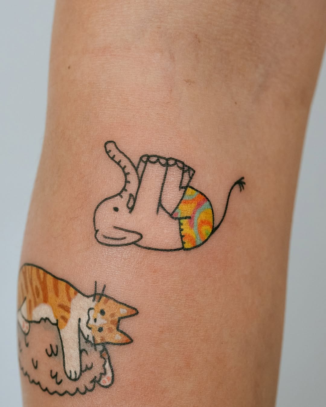 Playful elephant tattoo with a unique design Tattoo Design