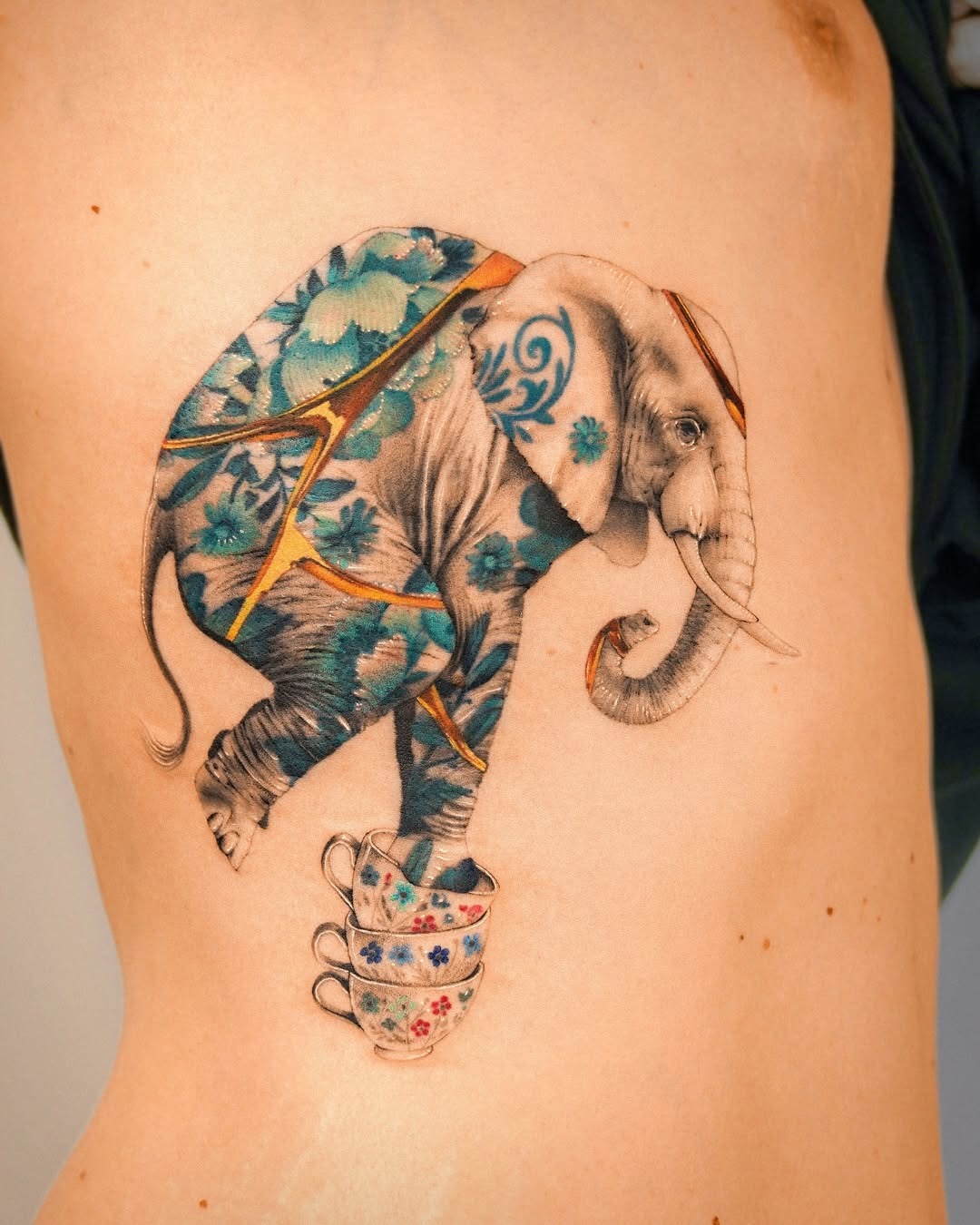 Unique elephant tattoo with floral patterns Tattoo Design