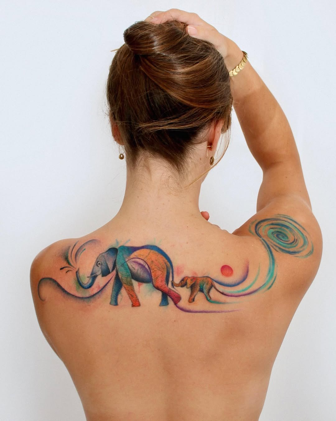 Vibrant watercolor family elephant tattoo Piece Tattoo Design